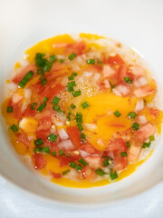 Preparing to make mixed eggs.