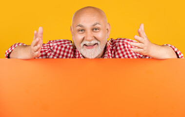 positive senior man with copy space on blank banner. advertising