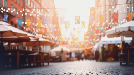 City street with garlands of lights, white blue holiday flags, blank bokeh background. Concept of autumn, Oktoberfest