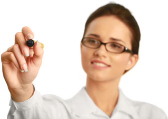 Professionally dressed female writing with a dry erase marker