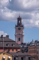 Fototapeten Stockholm Old houses and the tower of the church Storkyrkan, a sunny summer day in Stockholm  © Hans Baath