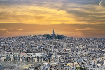 Paris, aerial view of the city, with Montmartre and the Sacre-Choeur basilica in background, sunset
