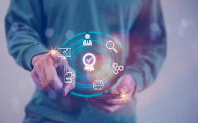 man using smartphone with the sign of the top service Quality assurance, Guarantee, Standards, ISO certification and standardization concept, satisfaction, service experience