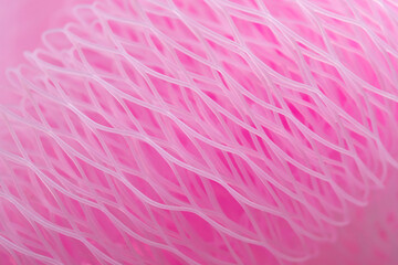 Abstract honeycomb pink background, polymer mesh, plastic.