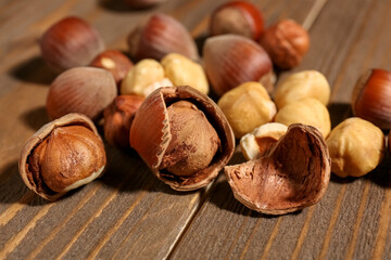 Shelled hazelnuts on wooden background