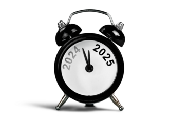 Black alarm clock on with number year. New year concept.