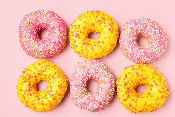 Sweet donuts on pink background