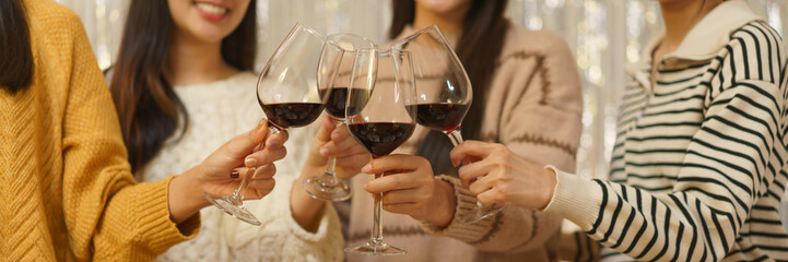 Birthday party concept, Asian girls standing to clinking glass of wine in celebrate birthday party