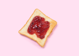 Toast with tasty jam on pink background