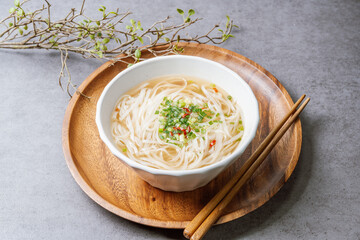 Vietnamese food rice noodle dish in a white bowl