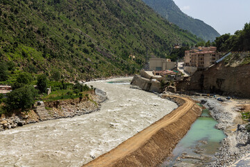 Protective boundary wall built against a high flood water in the river to prevent damages to the...