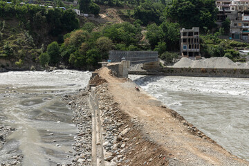 Washed out flood damaged of a road at madyan that connects the villages across the river of swat...