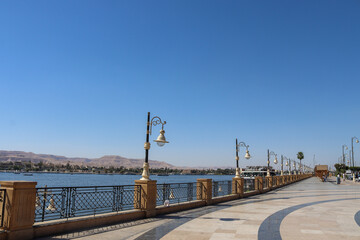 Promenade and streetlights along  Nile river in luxor city egypt