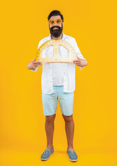 cheerful man with geometry protractor on background. photo of man with geometry protractor.