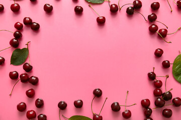 Frame made of sweet cherries on pink background
