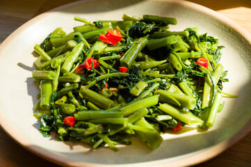 Sri Lankan style stir fried kangkung dish on a plate