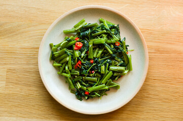 Sri Lankan style stir fried kangkung dish on a plate