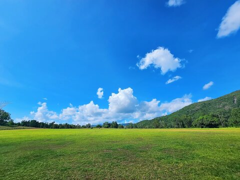 Beautiful blue sky and clouds with mountain meadow plain landscape background for summer poster the best view morning skies