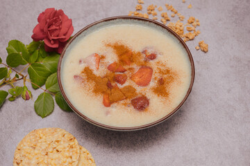 Semolina with milk and strawberries. Top view of farina. Flat lay photo showing a delicious breakfast or dinner
