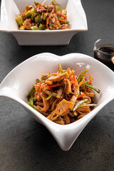Closeup on assorted asian chinese salad portions