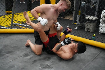 Two professional boxers fighting at the gym