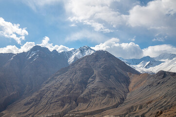 The barren landscape of Leh, Ladakh. Landscape view of rocky land surrounded by snow-covered...