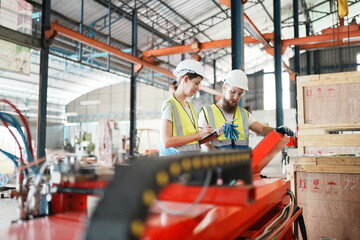 Industrial Engineer at work in factory, industrial engineers working at automated AI robotic production factory - New technology concept
