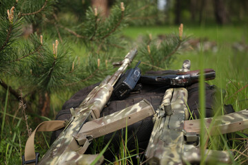 Folded weapons in combat position