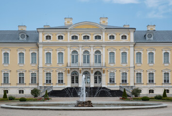 Rundale Palace in the Bauska Municipality in Latvia. Baroque yellow building with fountain, front view
