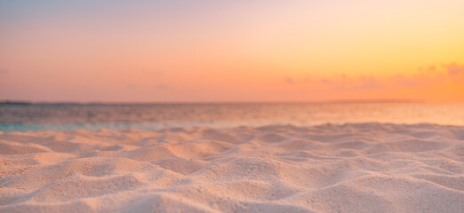 Closeup beach coast sand texture with warm gold orange sunset light. Fantasy beach landscape sky...