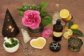 
Love potion preparation for magical spell with ingredients of rose flower, thyme, mint, lemon fruit and honey. Occult divination esoteric concept for unrequited love.