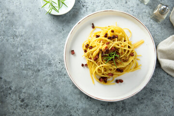 Spaghetti with bacon and rosemary