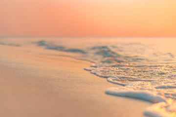 Closeup sea sand waves. Panoramic beach landscape. Inspire tropical beach seascape horizon. Orange and golden sunset sky calmness tranquil relaxing sunlight summer peace. Meditation inspire vacation