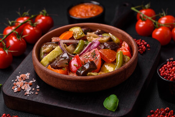 Delicious fresh vegetarian salad with tomatoes, green beans, eggplant and pepper
