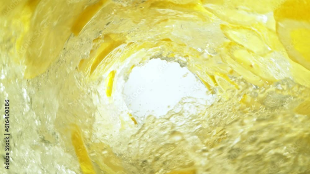 Leinwandbilder super slow motion of water wave with lemon slices. water surf wave rotating around in creating tunne
