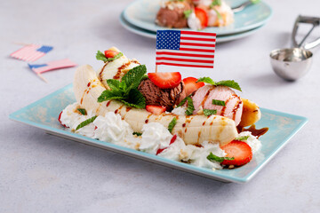 Banana split ice cream with American flag, top view