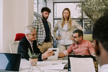 Four people working together in the office