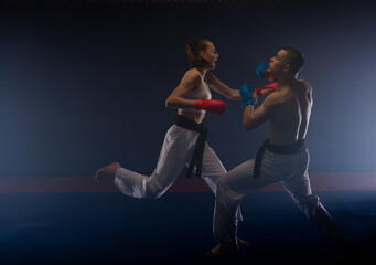 Fototapeta na wymiar Fighting at the karate studio