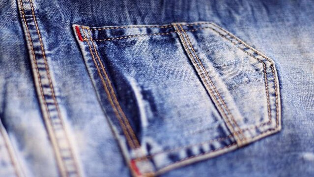 Denim stylish background. Jeans pocket. Slow motion.