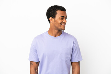African American handsome man on isolated white background looking side