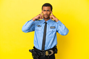 African American police man over isolated yellow background having doubts and thinking