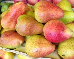 Heap of ripe tasty pears close up