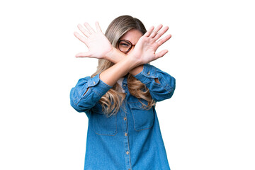 Young Uruguayan woman over isolated background nervous stretching hands to the front