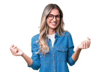 Young Uruguayan woman over isolated background making money gesture