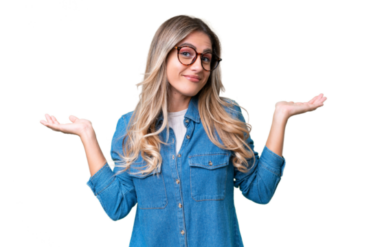 Young Uruguayan woman over isolated background making doubts gesture