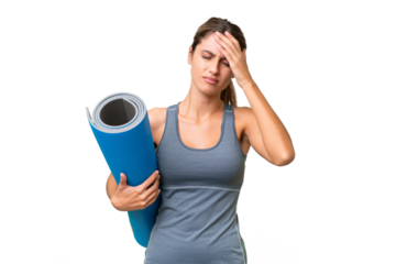 Pretty Young Uruguayan sport woman going to yoga classes while holding a mat over isolated background with headache