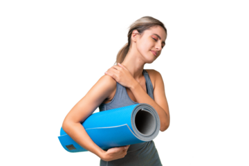 Pretty Young Uruguayan sport woman going to yoga classes while holding a mat over isolated background suffering from pain in shoulder for having made an effort