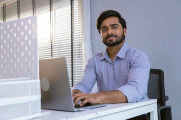 Portrait of young business friends gathered in a modern office conference room and worked as a team