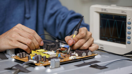 Electronics technician, electronic engineering electronic repair,electronics measuring and testing, repair and maintenance concepts.