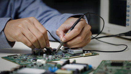 Electronics technician, electronic engineering electronic repair,electronics measuring and testing, repair and maintenance concepts.